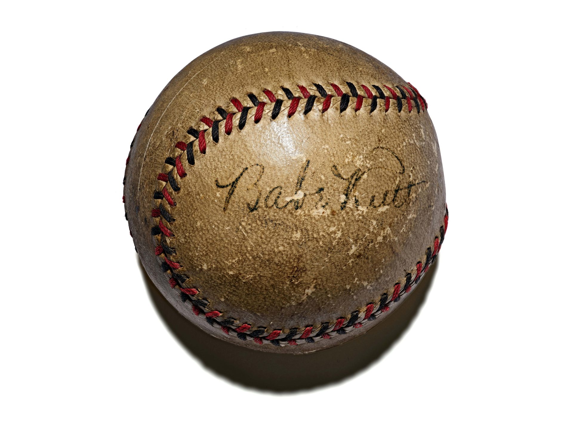 Vintage baseball bearing the signature of Babe Ruth.