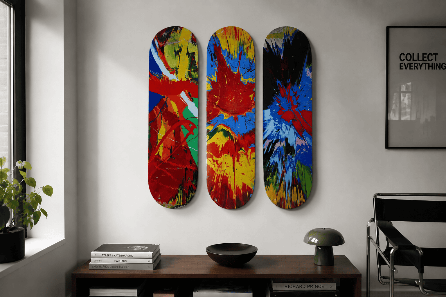 Three colorful artist skateboard decks displayed together on a modern interior wall.