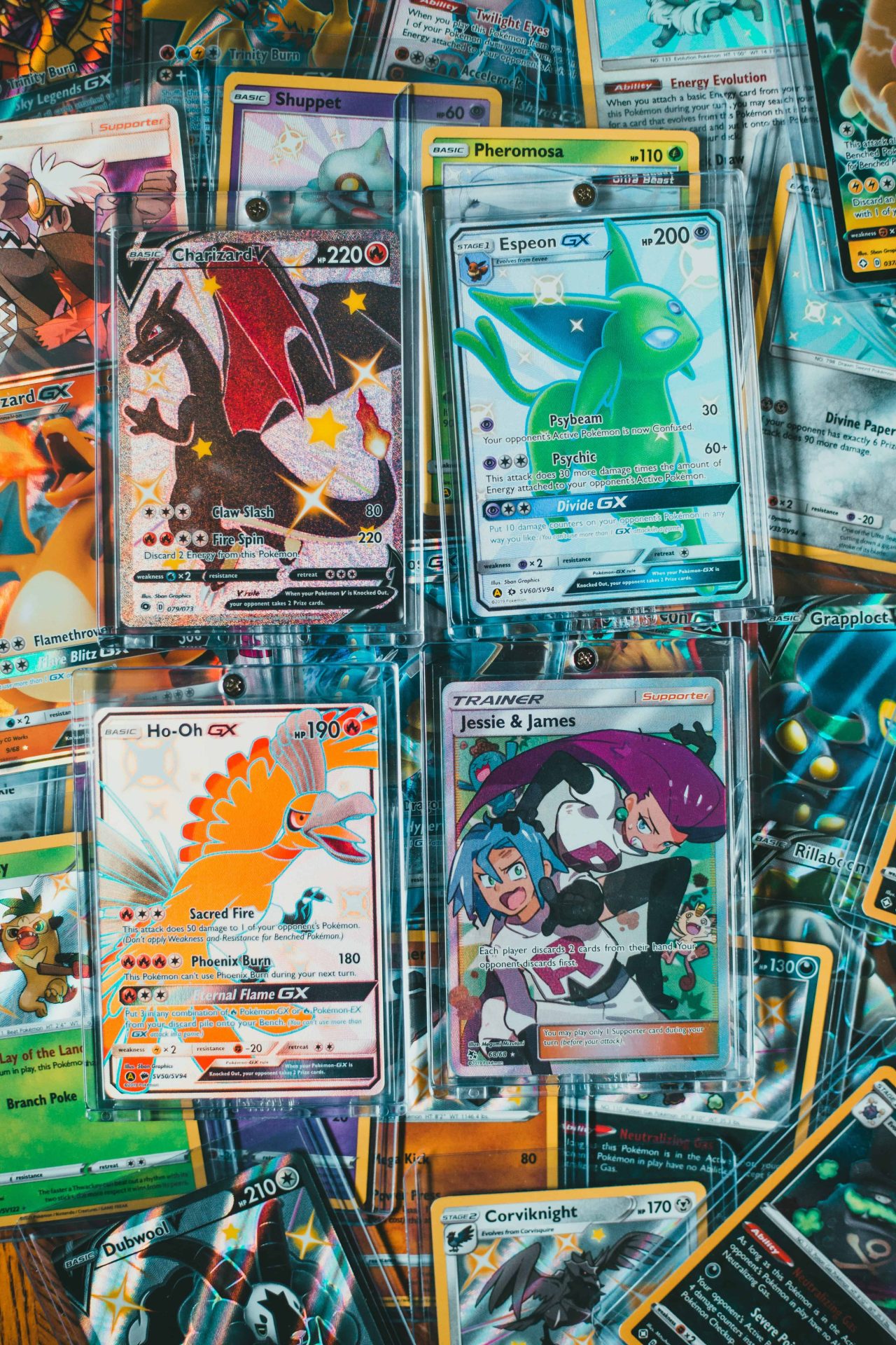 Collection of Pokémon trading cards displayed in protective plastic holders.